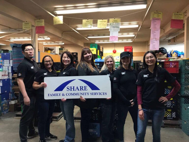 QMC staff volunteering their time at Share Food Bank