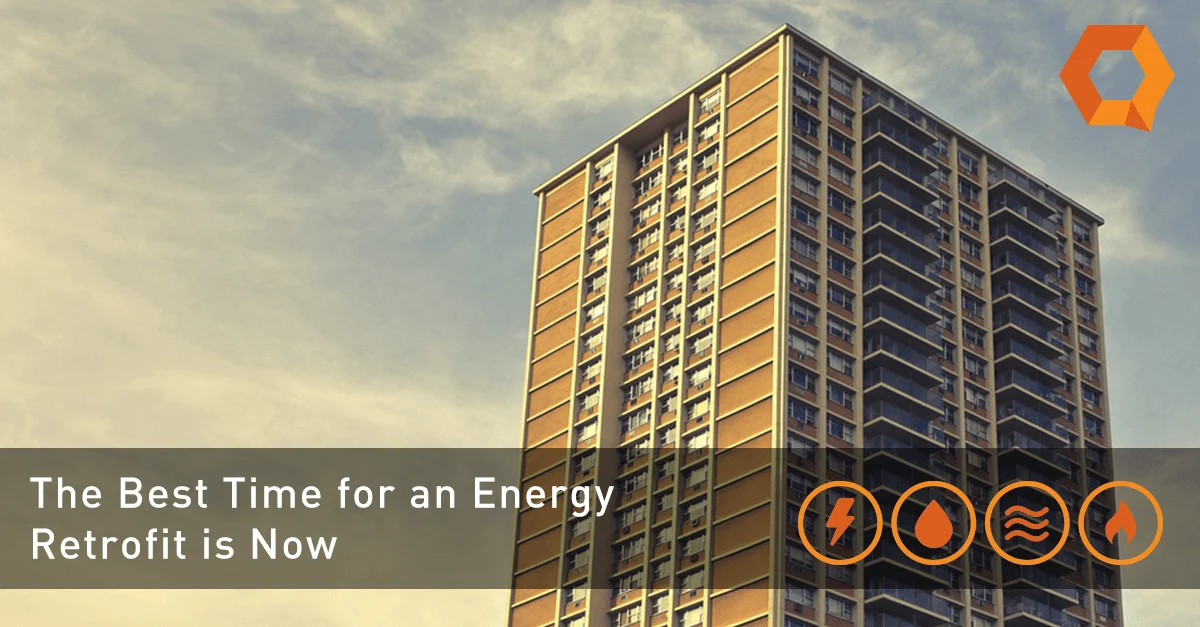 QMC-Metering-Solutions-the-best-time-for-an-energy-retrofit-is-now image of a high rise building perfectly suited for an energy retrofit. the words The best time for an energy retrofit is now are visible
